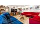 Comfortable living room with colorful couches, modern decor, and hardwood floors at 6911 N Tuxedo St, Indianapolis, IN 46220