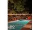 Backyard swimming pool featuring a seating area and ambient string lighting at 6911 N Tuxedo St, Indianapolis, IN 46220