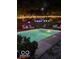 Pool with lounge chairs and ambient multi-colored lighting at 6911 N Tuxedo St, Indianapolis, IN 46220