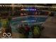 Swimming pool and patio area featuring planters and ambient string lighting at 6911 N Tuxedo St, Indianapolis, IN 46220