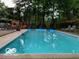 Backyard in-ground pool with night lighting and lounge furniture at 6911 N Tuxedo St, Indianapolis, IN 46220