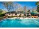 Backyard pool featuring ample patio space and outdoor seating, perfect for entertaining guests at 6911 N Tuxedo St, Indianapolis, IN 46220
