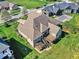 Spacious backyard with a deck, pergola, and stairs leading to a lush, green lawn at 7128 Trail Ridge Ln, Indianapolis, IN 46259