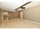 Finished basement room with carpet, ceiling fan, and doorway at 7128 Trail Ridge Ln, Indianapolis, IN 46259