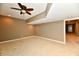 Finished basement room with carpet, neutral walls, and a ceiling fan at 7128 Trail Ridge Ln, Indianapolis, IN 46259