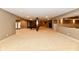 Finished basement featuring a pool table, staircase, and open layout at 7128 Trail Ridge Ln, Indianapolis, IN 46259