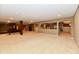 Finished basement boasting a recreational area and a stylish bar area at 7128 Trail Ridge Ln, Indianapolis, IN 46259