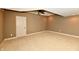 Cozy basement room featuring neutral walls and carpet, with a ceiling fan at 7128 Trail Ridge Ln, Indianapolis, IN 46259