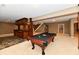 Finished basement boasting a pool table, bar area, and staircase at 7128 Trail Ridge Ln, Indianapolis, IN 46259