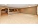 Open basement area with recessed lighting and view into the media room at 7128 Trail Ridge Ln, Indianapolis, IN 46259