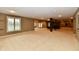 Spacious finished basement with neutral carpet, recessed lighting, and a pool table at 7128 Trail Ridge Ln, Indianapolis, IN 46259