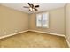 An inviting bedroom offers carpet floors and a window with shutter blinds, perfect for relaxation at 7128 Trail Ridge Ln, Indianapolis, IN 46259