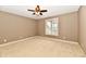 Bedroom featuring neutral walls, carpet, and a window at 7128 Trail Ridge Ln, Indianapolis, IN 46259