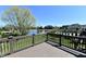 Spacious deck overlooking a beautiful landscaped yard and pond, perfect for outdoor relaxation and entertaining at 7128 Trail Ridge Ln, Indianapolis, IN 46259
