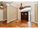 Inviting entryway with hardwood floors, a decorative chandelier, and classic wall paneling at 7128 Trail Ridge Ln, Indianapolis, IN 46259