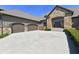 Beautiful stone facade home with a large driveway and well-maintained landscaping at 7128 Trail Ridge Ln, Indianapolis, IN 46259