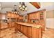 Kitchen island featuring custom cabinetry and granite countertop at 7128 Trail Ridge Ln, Indianapolis, IN 46259