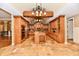 Open kitchen featuring custom cabinetry, an island, and stone tile flooring at 7128 Trail Ridge Ln, Indianapolis, IN 46259
