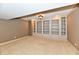 Spacious living room features built-in shelving and neutral carpeting at 7128 Trail Ridge Ln, Indianapolis, IN 46259