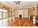 Bright living room featuring hardwood floors, fireplace with built-ins, and elegant finishes at 7128 Trail Ridge Ln, Indianapolis, IN 46259