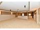 Finished basement with an open floor plan and wainscoting at 7128 Trail Ridge Ln, Indianapolis, IN 46259