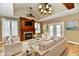 Cozy living room with a fireplace, built-in shelving, and a stylish decor, creating an inviting atmosphere at 7128 Trail Ridge Ln, Indianapolis, IN 46259