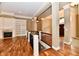 Spacious living room with hardwood floors, fireplace, and built-in bookshelves at 7128 Trail Ridge Ln, Indianapolis, IN 46259
