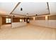 Finished basement with an open floor plan and wainscoting at 7128 Trail Ridge Ln, Indianapolis, IN 46259
