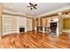Bright living room featuring hardwood floors, fireplace with built-ins, and elegant finishes at 7128 Trail Ridge Ln, Indianapolis, IN 46259