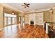 Bright living room featuring hardwood floors, fireplace with built-ins, and elegant finishes at 7128 Trail Ridge Ln, Indianapolis, IN 46259