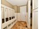 Bright mudroom with built-in storage lockers and a tile floor at 7128 Trail Ridge Ln, Indianapolis, IN 46259
