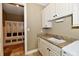 Well-organized mudroom with built-in storage lockers and convenient sink at 7128 Trail Ridge Ln, Indianapolis, IN 46259