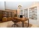 Cozy office features a desk, bookshelves, and a comfortable chair at 7128 Trail Ridge Ln, Indianapolis, IN 46259