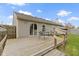 Backyard featuring wooden deck with table and gray siding at 7219 Snider Ct, Indianapolis, IN 46221