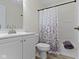 Bathroom featuring wood-look flooring, tub, vanity, and shower with curtain at 7219 Snider Ct, Indianapolis, IN 46221