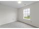 Neutral bedroom with carpeted floor and natural light from window at 7219 Snider Ct, Indianapolis, IN 46221