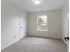 Bright bedroom with carpeted floor and natural light from window at 7219 Snider Ct, Indianapolis, IN 46221