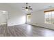 Spacious bedroom featuring wood-look floors, neutral walls, and natural light at 7219 Snider Ct, Indianapolis, IN 46221