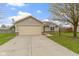 Charming single-story home with a two-car garage and well-maintained front yard at 7219 Snider Ct, Indianapolis, IN 46221