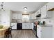 Bright kitchen featuring white cabinetry, stainless steel appliances, and a modern black faucet at 7219 Snider Ct, Indianapolis, IN 46221