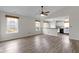 Bright living room featuring high ceilings, wood-look floors, and large windows at 7219 Snider Ct, Indianapolis, IN 46221