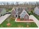 Aerial view of a two-story home featuring a well-maintained lawn and mature trees at 7501 Independence Dr, Zionsville, IN 46077