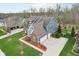 Aerial view of the home featuring an attached two-car garage and manicured lawn at 7501 Independence Dr, Zionsville, IN 46077