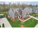 Aerial view of a two-story home with a well-manicured lawn and mature trees at 7501 Independence Dr, Zionsville, IN 46077
