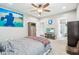 A bedroom featuring a full bed, ceiling fan, and ensuite bathroom at 7501 Independence Dr, Zionsville, IN 46077