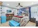 A stylish bedroom with a full bed, tv, ceiling fan, and a fun, youthful design at 7501 Independence Dr, Zionsville, IN 46077