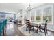 Bright dining area with ample natural light, a modern chandelier, and easy access to the living spaces at 7501 Independence Dr, Zionsville, IN 46077