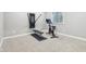 Finished basement gym area with a Peloton bike and workout machine at 7501 Independence Dr, Zionsville, IN 46077