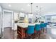 Modern kitchen with a large island, stainless steel appliances, and open access to the living area at 7501 Independence Dr, Zionsville, IN 46077