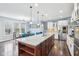 Bright kitchen featuring stainless steel appliances, granite countertops, and hardwood floors, great for cooking and entertaining at 7501 Independence Dr, Zionsville, IN 46077